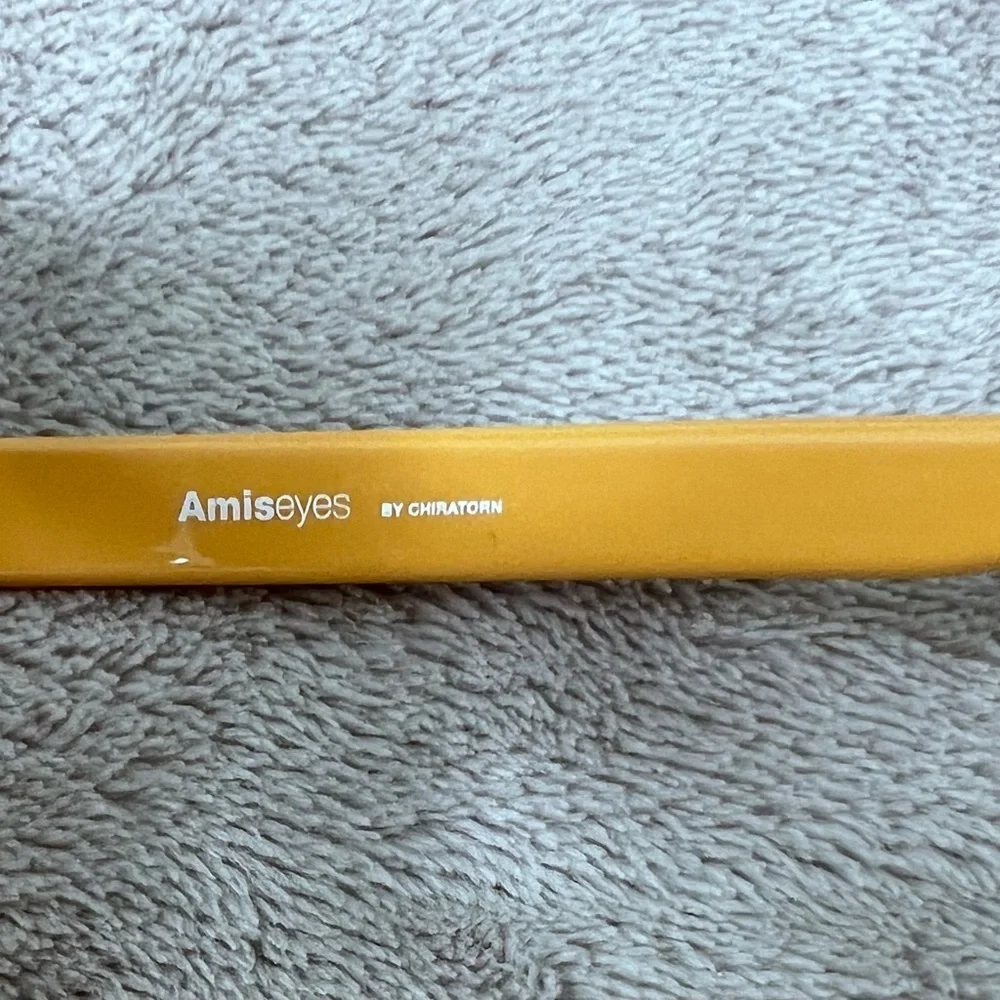 Amiseyes yellow and white spectacles.